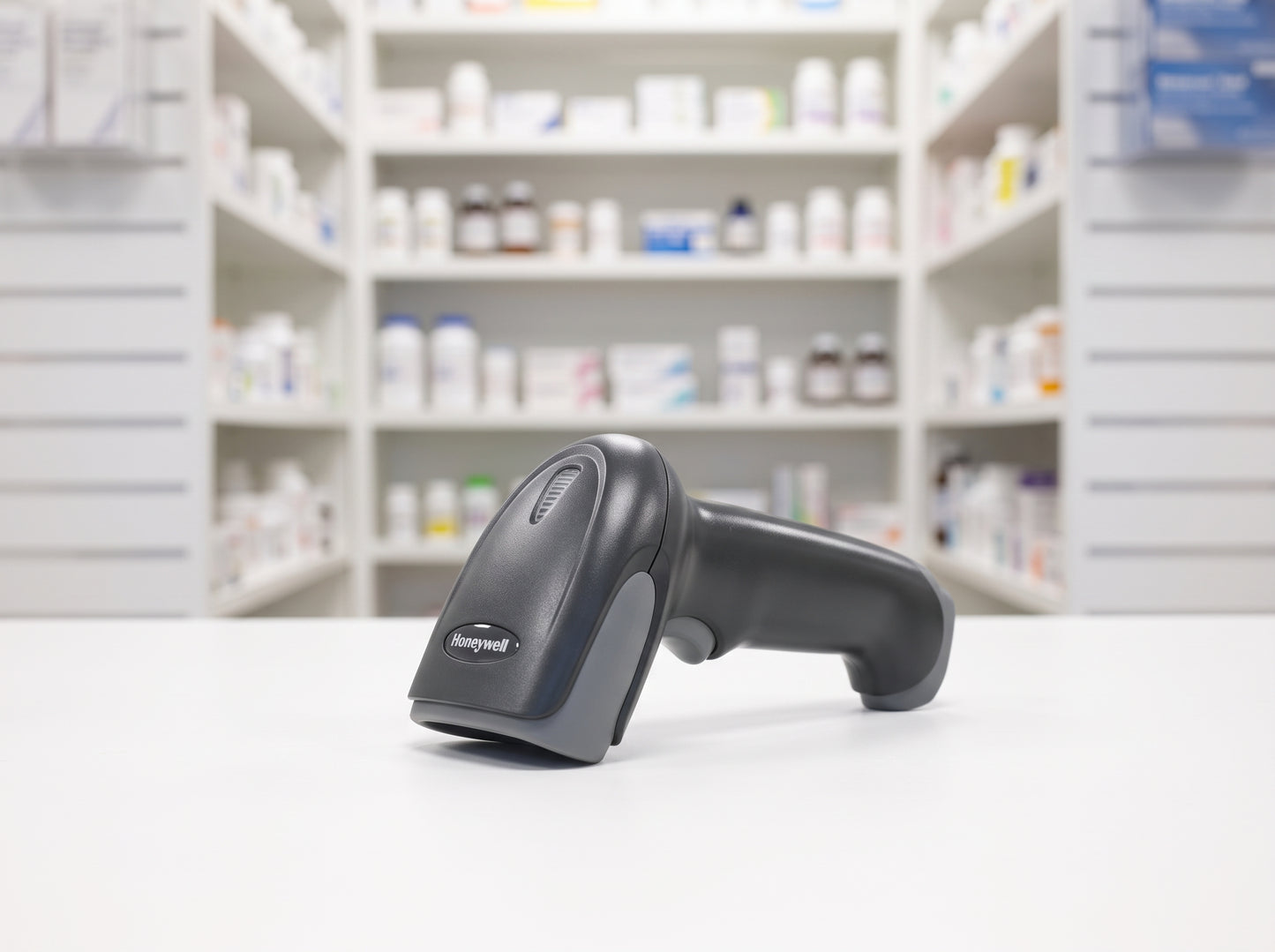 Honeywell Voyager XP 1472g cordless barcode scanner on a pharmacy counter, scanner only, charge base not included