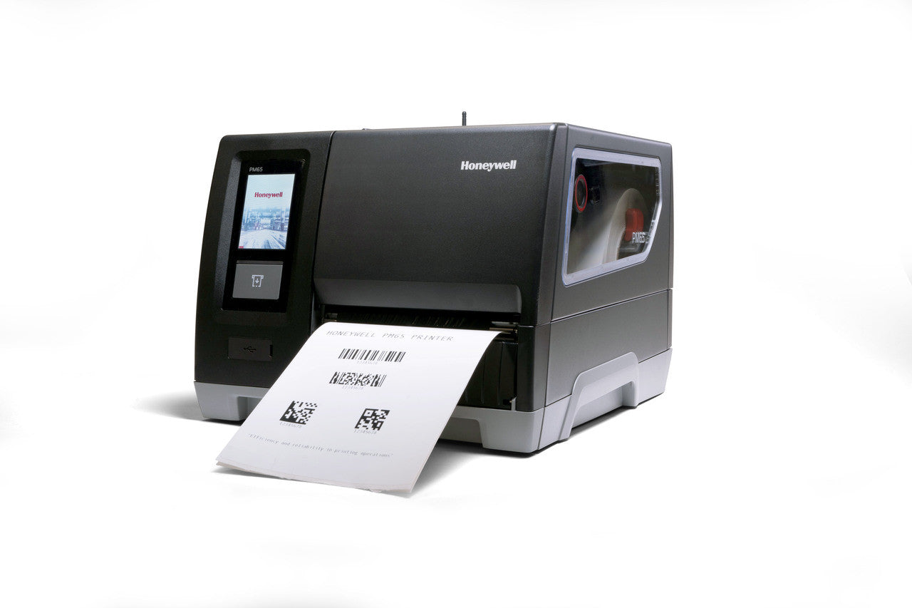 Honeywell PM65A industrial label printer producing a printed label