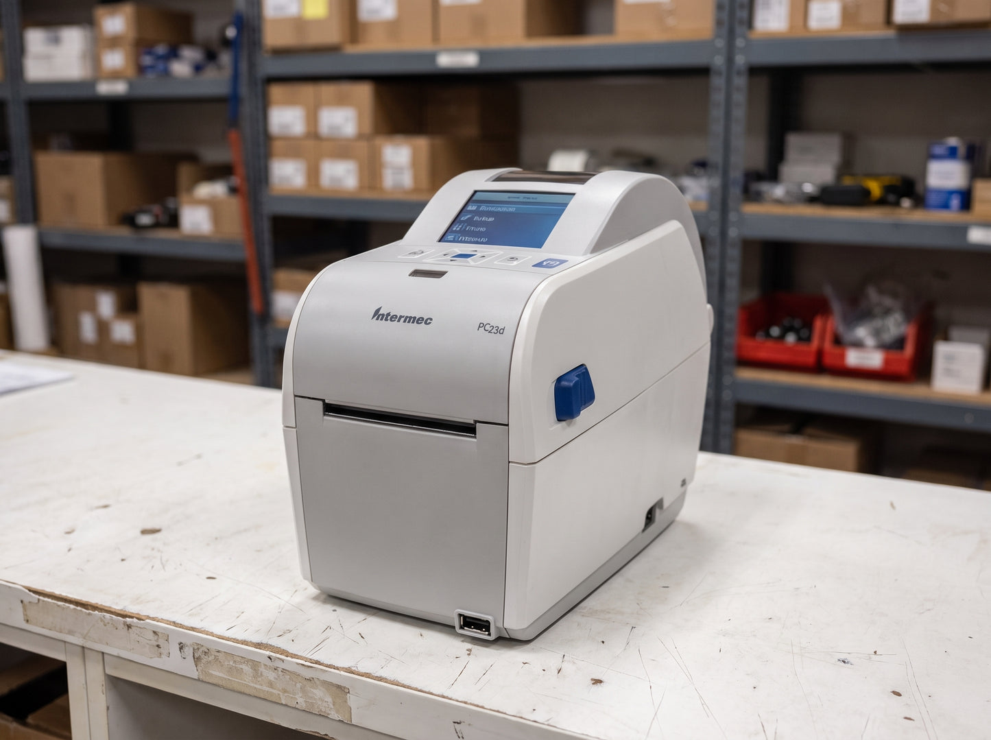 Honeywell PC23d direct thermal desktop label printer on a warehouse packing bench