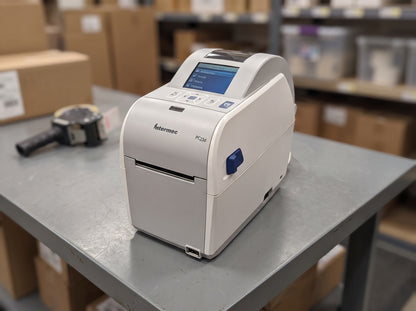 Honeywell PC23d 2-inch direct thermal label printer on a stockroom shipping bench