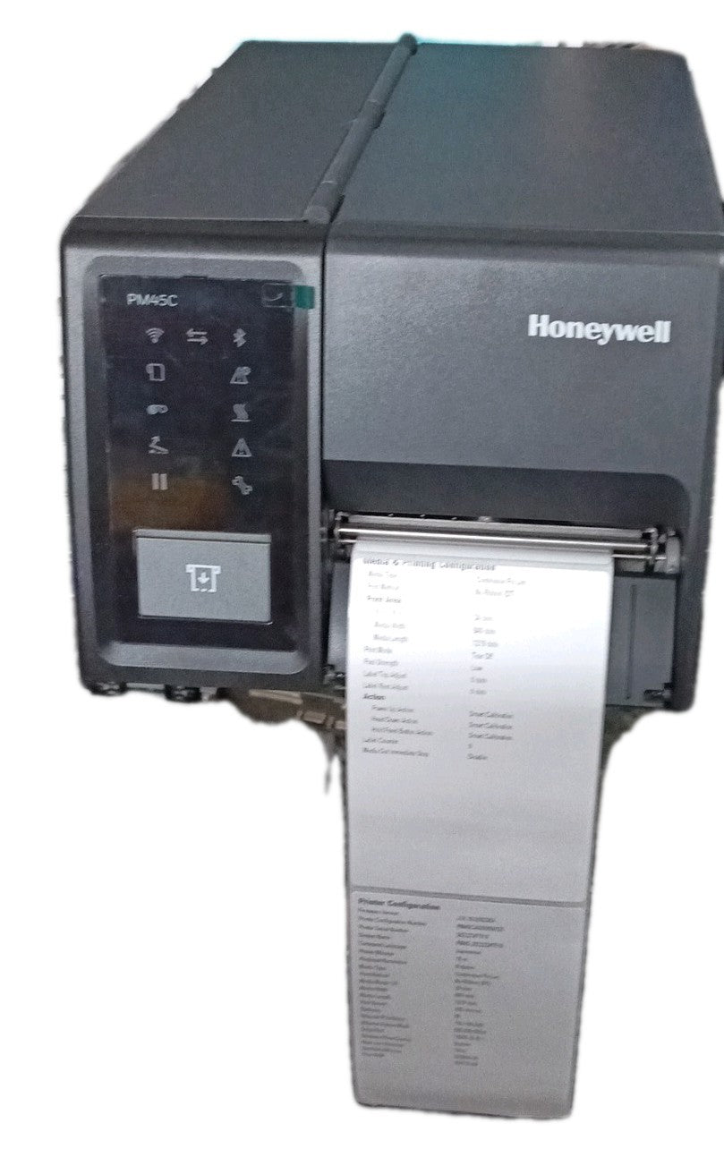 Honeywell PM45c compact industrial label printer, front view showing the PM45C icon display control panel and a printed configuration label