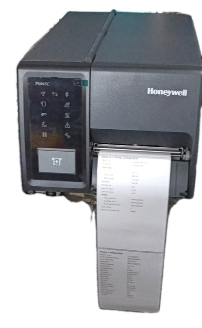 Honeywell PM45c compact industrial label printer, front view showing the PM45C icon display control panel and a printed configuration label