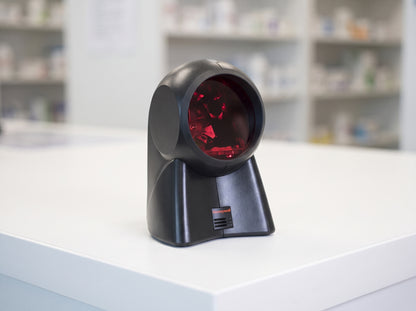 Honeywell Orbit 7120 omnidirectional presentation laser scanner in black on a retail checkout counter — AI-generated image