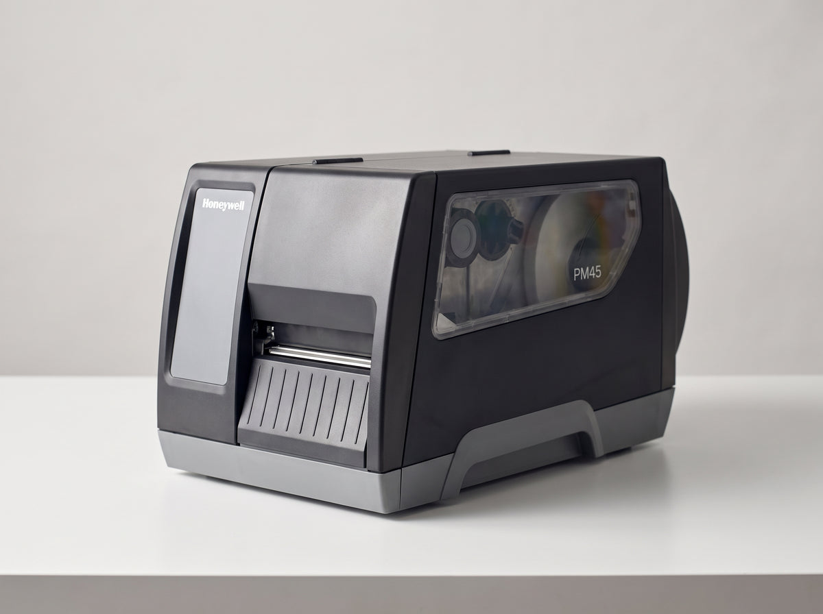 Honeywell PM45A industrial label printer in dark grey on a retail checkout counter — AI-generated image