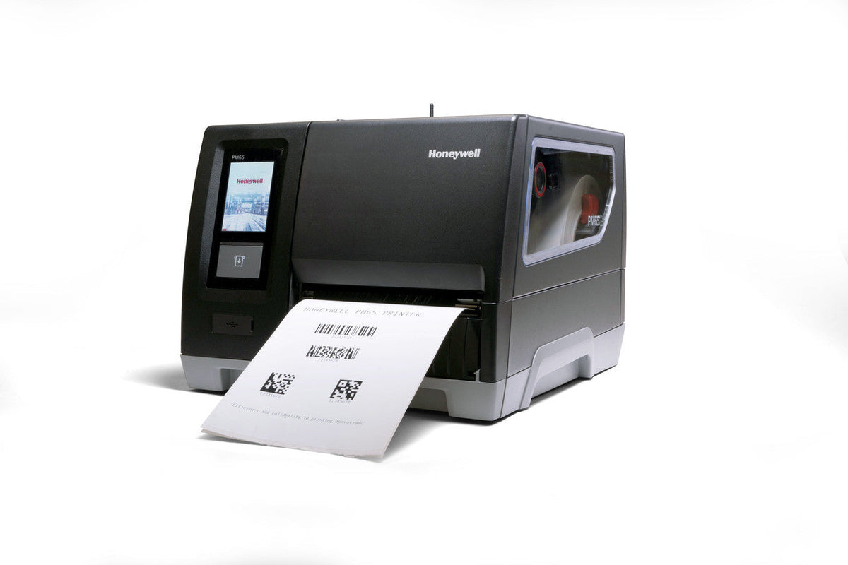 Honeywell PM65 industrial label printer producing a printed label