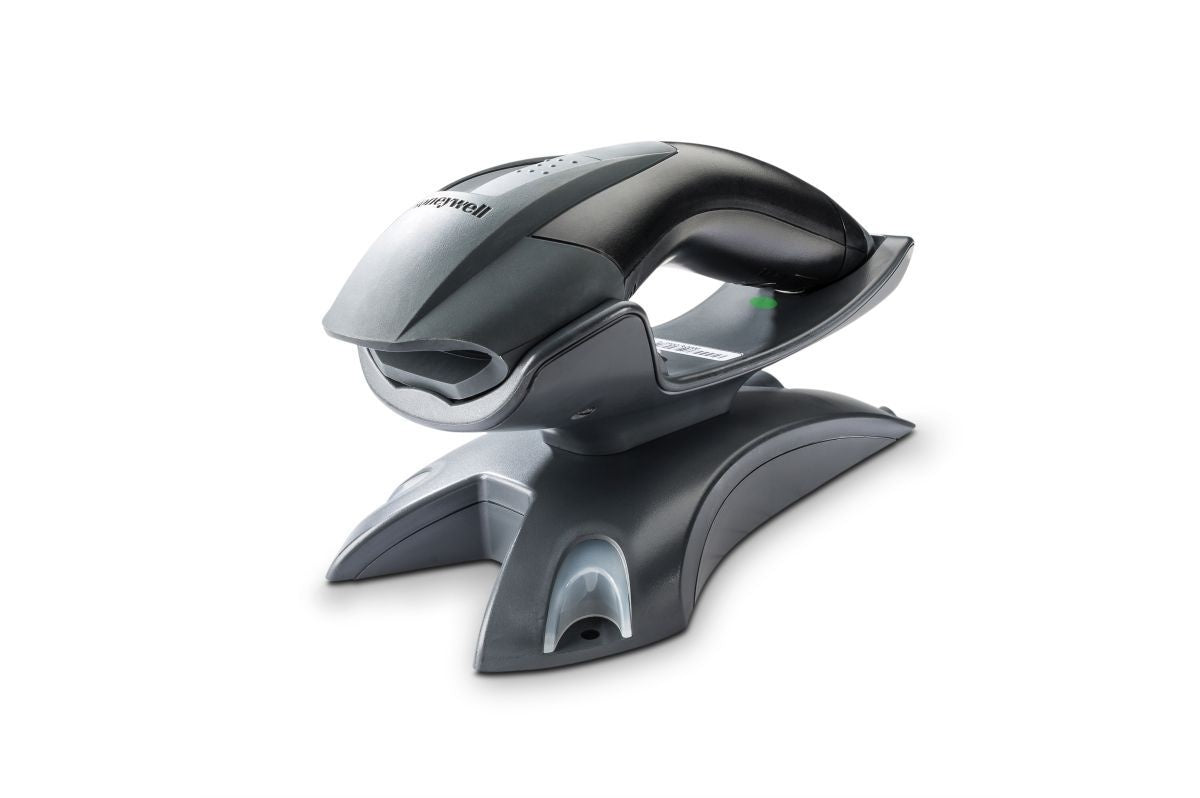 Honeywell Voyager 1202g — scanner seated in its charge and communication base