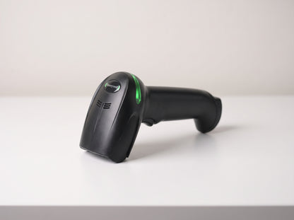 Honeywell Xenon XP 1950g corded 1D/2D barcode scanner in black on a retail checkout counter — AI-generated image