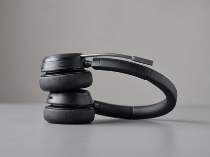 Poly Voyager Focus 2 UC headset folded flat, no charge stand — AI-generated image