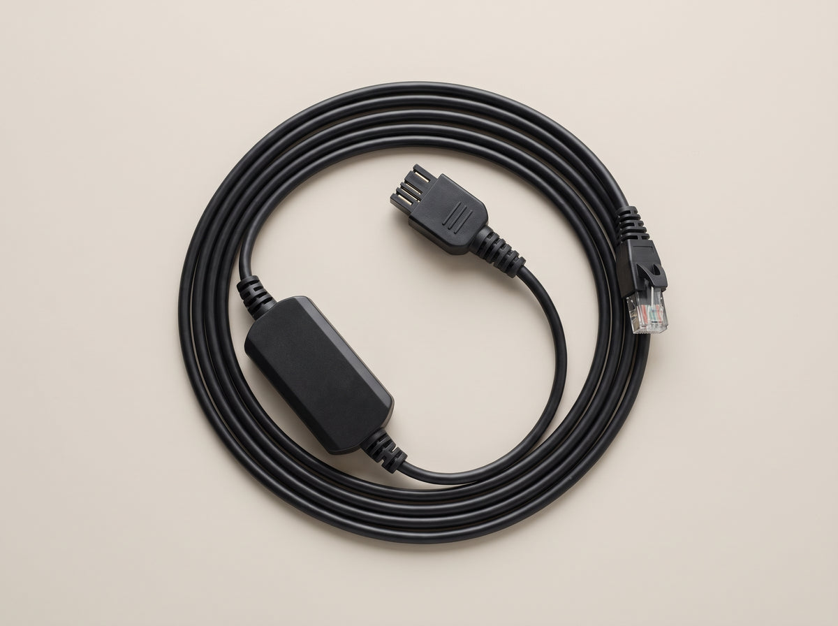 Poly APP-51 electronic hookswitch cable coiled flat, both connector ends visible  — AI-generated image