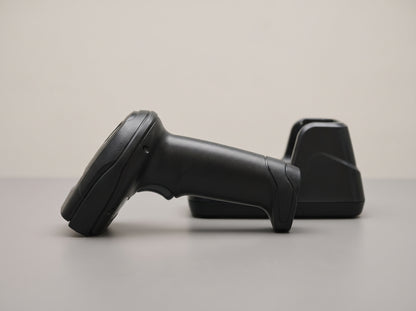Zebra LI4278 cordless linear imager and charging cradle in black, side profile — AI-generated image