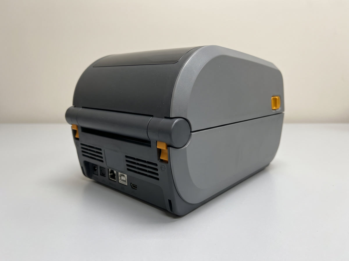 Zebra ZD411 2-inch direct thermal desktop label printer, rear panel showing the USB and Ethernet ports — AI-generated image