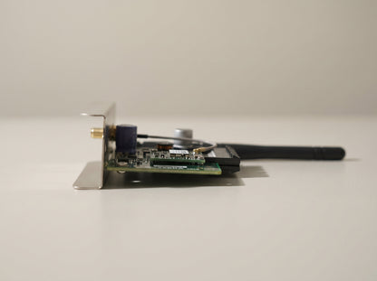 Zebra ZebraNet 802.11ac wireless card seen edge-on with its stub antenna — AI-generated image