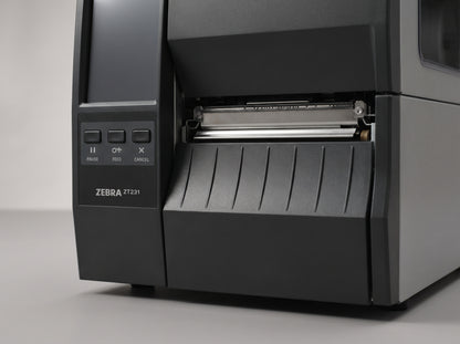 Zebra ZT231 industrial label printer, low front view of the media door and tear-off edge — AI-generated image